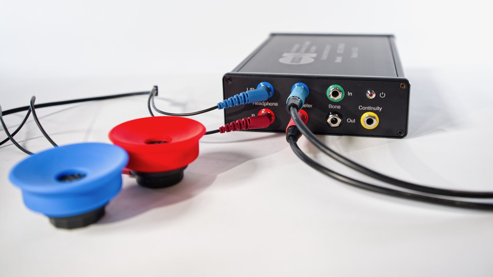 Audiometer headphones and cables connected to the front of the ACS-100 SA3